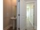 Modern powder room with pedestal sink and mirror at 207 Halemarge Drive Dr, Belmont, NC 28012
