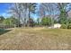 A nice large, flat backyard with a storage shed and a fence at 2100 Sunderland Pl, Charlotte, NC 28211