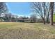 This large backyard is fully fenced and features mature trees providing plenty of shade and privacy at 2100 Sunderland Pl, Charlotte, NC 28211