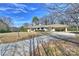 Traditional home boasting a long private driveway and a convenient covered carport at 2100 Sunderland Pl, Charlotte, NC 28211