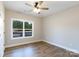 Bedroom with wood-look floors, a ceiling fan and natural light from the window at 2364 Valley Meadows Dr, York, SC 29745