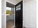 Welcoming entryway featuring a black front door and white closet, offering a glimpse of the outdoors at 2364 Valley Meadows Dr, York, SC 29745