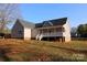 Rear exterior view of a light brown house showing the back porch and yard at 2364 Valley Meadows Dr, York, SC 29745