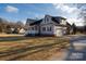Spacious home with a covered porch, attached garage, and sprawling front lawn at 2364 Valley Meadows Dr, York, SC 29745