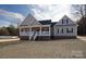 Charming home featuring a covered front porch and gray siding, located on a spacious lot at 2364 Valley Meadows Dr, York, SC 29745