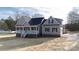 Charming home with a large front porch, black shutters, and manicured front yard at 2364 Valley Meadows Dr, York, SC 29745