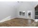 Spacious living room featuring wood floors, a vaulted ceiling, and a large window with natural light at 2364 Valley Meadows Dr, York, SC 29745