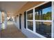 Side porch featuring natural wood floors, wide windows and black lighting fixtures at 2364 Valley Meadows Dr, York, SC 29745