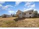 Spacious backyard with an exterior view of the brick home, offering plenty of room for outdoor activities at 2365 Kool Park Ne Rd, Hickory, NC 28601