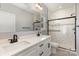 Stylish bathroom featuring double vanity sinks, modern fixtures, and a sleek shower with glass doors at 2365 Kool Park Ne Rd, Hickory, NC 28601
