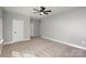 Spacious bedroom with neutral carpet, gray walls, and a ceiling fan at 2365 Kool Park Ne Rd, Hickory, NC 28601