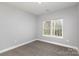 Neutral bedroom with carpet, window, and base molding is awaiting your personal touch at 2365 Kool Park Ne Rd, Hickory, NC 28601