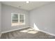 Bright bedroom with large window, neutral paint, and plush carpeting. Ready to move in at 2365 Kool Park Ne Rd, Hickory, NC 28601