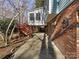 Spacious backyard with mature trees and a wooden deck at 2650 Whisper Ridge Ln, Matthews, NC 28105