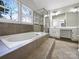 Spacious bathroom with double sinks, soaking tub, and shower at 2650 Whisper Ridge Ln, Matthews, NC 28105