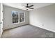 Bright bedroom with carpet flooring and ceiling fan at 2650 Whisper Ridge Ln, Matthews, NC 28105