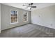 Bright bedroom with ceiling fan and carpet flooring at 2650 Whisper Ridge Ln, Matthews, NC 28105