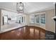 Open dining room with hardwood floors and view of kitchen at 2650 Whisper Ridge Ln, Matthews, NC 28105