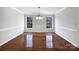 Formal dining room with hardwood floors and wainscoting at 2650 Whisper Ridge Ln, Matthews, NC 28105