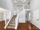 Bright and spacious entryway with hardwood floors and a staircase at 2650 Whisper Ridge Ln, Matthews, NC 28105