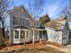 Charming two-story home with a covered front porch, bay window, and landscaped front yard at 2650 Whisper Ridge Ln, Matthews, NC 28105