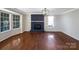 Living room with hardwood floors, fireplace, and bay window at 2650 Whisper Ridge Ln, Matthews, NC 28105
