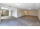 Spacious living room with carpeted floor and access to other rooms at 2650 Whisper Ridge Ln, Matthews, NC 28105