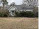 Features a weathered, one-story house with overgrown landscaping and peeling paint at 2801 Pennsylvania Ave, Kannapolis, NC 28083
