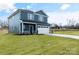 Beautiful two-story home with blue siding, stone accents, and a well-manicured front yard at 3020 Swallowtail Ln # 38, Kannapolis, NC 28023