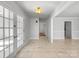 Bright and airy entryway with tile floors and French doors at 3026 Windsor Chase Dr, Matthews, NC 28105