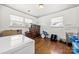 Functional bedroom featuring hardwood floors, abundant natural light, and ample space for storage at 3949 Fieldcrest Rd, Charlotte, NC 28217