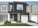 Modern two-story townhome with gray siding and two-car garage at 4114 Lattistep Ln, Charlotte, NC 28269