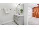 Modern bathroom with gray vanity, black hardware, decorative mirror and cedar closet at 4125 Rivendell Ln, Mint Hill, NC 28227