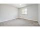Neutral bedroom with carpet and window at 4125 Rivendell Ln, Mint Hill, NC 28227