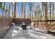 Private backyard deck with outdoor seating, perfect for enjoying peaceful views and entertaining guests at 4125 Rivendell Ln, Mint Hill, NC 28227