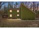 Charming two-story home with a unique architectural design and natural outdoor setting at 4125 Rivendell Ln, Mint Hill, NC 28227