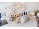 Spacious living room with sectional seating, cathedral ceiling, and stairs to loft at 4125 Rivendell Ln, Mint Hill, NC 28227