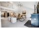 Open living space with large sectional, cathedral ceiling, and natural light at 4125 Rivendell Ln, Mint Hill, NC 28227