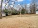 Large backyard with mature trees and open space at 415 N Fifth St, Albemarle, NC 28001