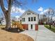 Rear view of house showcasing deck and brick details at 415 N Fifth St, Albemarle, NC 28001