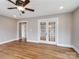 Living area with hardwood floors and French doors at 415 N Fifth St, Albemarle, NC 28001