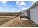 This backyard features a lake and a concrete patio with a swing at 4209 Jones Creek Ln, Charlotte, NC 28215