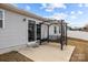 A backyard featuring a patio with a swing, and sliding glass doors to enter the house at 4209 Jones Creek Ln, Charlotte, NC 28215