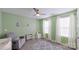 Cozy bedroom with a gray accent wall, ample natural light, and calming decor at 4209 Jones Creek Ln, Charlotte, NC 28215