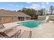 Backyard swimming pool with slide, lounge chairs, and screened-in porch at 47997 Wagoner Rd, Richfield, NC 28137