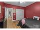 Bedroom with wood floors and a closet with double doors at 47997 Wagoner Rd, Richfield, NC 28137