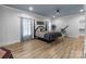Spacious primary bedroom features a decorative ceiling, wood-look floors, and a four-poster bed at 47997 Wagoner Rd, Richfield, NC 28137