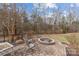 Outdoor fire pit with seating and a brick patio, perfect for entertaining at 47997 Wagoner Rd, Richfield, NC 28137