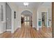 Inviting foyer with hardwood floors, arched doorways, and views into adjoining living spaces creating seamless transition at 47997 Wagoner Rd, Richfield, NC 28137