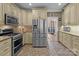 Bright kitchen with stainless steel appliances, tile backsplash, and ample cabinet space at 47997 Wagoner Rd, Richfield, NC 28137